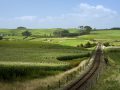 nakedearth_day_traintrackstoteroti_2880x1800